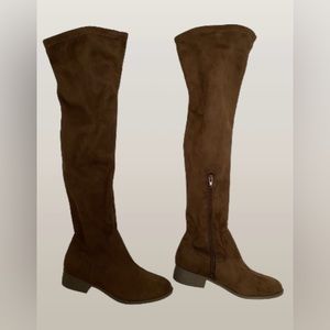 Brown suede flat heel thigh high boots with zipper on the side of lower boots